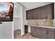 Convenient wet bar with upper and lower cabinets, a sink, and room to work at 687 W Flintlock Way, Chandler, AZ 85286