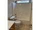 This bathroom features a white shower and tub, along with a toilet and a sink and vanity at 7176 W Blackhawk Dr, Glendale, AZ 85308