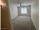 Bedroom features a ceiling fan and a window with blinds at 7176 W Blackhawk Dr, Glendale, AZ 85308