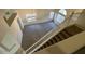 View from the top of the staircase that overlooks a bright living room with neutral carpet at 7176 W Blackhawk Dr, Glendale, AZ 85308