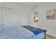 Bedroom featuring a large bed and closet at 7234 W Aire Libre Ave, Peoria, AZ 85382