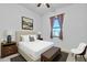 Bedroom with neutral tones, decorative art and window at 7234 W Aire Libre Ave, Peoria, AZ 85382