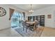 Inviting dining room with sliding door access to the backyard and ample natural light at 7234 W Aire Libre Ave, Peoria, AZ 85382