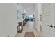 Hallway with natural lighting and view into an open floor plan, leading to the living room at 7234 W Aire Libre Ave, Peoria, AZ 85382