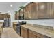 Well-equipped kitchen featuring granite countertops, stainless steel appliances, and ample cabinets at 7234 W Aire Libre Ave, Peoria, AZ 85382