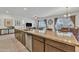 Bright kitchen boasts a large island with a sink, stainless steel appliances, and open layout design at 7234 W Aire Libre Ave, Peoria, AZ 85382