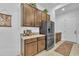 Modern kitchen featuring granite countertops, stainless steel appliances, and ample cabinet storage at 7234 W Aire Libre Ave, Peoria, AZ 85382