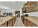 Bright open kitchen featuring granite countertops, stainless steel appliances, and stylish cabinetry at 7234 W Aire Libre Ave, Peoria, AZ 85382