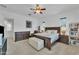 Comfortable main bedroom featuring a king bed, dresser, and cozy window seat at 7234 W Aire Libre Ave, Peoria, AZ 85382