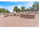 Expansive brick-paved patio featuring a built-in BBQ and fireplace, ideal for gatherings and relaxation at 7524 E Leland Cir, Mesa, AZ 85207