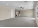 The bonus room features neutral walls, carpet, and recessed lighting at 7524 E Leland Cir, Mesa, AZ 85207