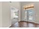 Spacious entryway boasts high ceilings, tile flooring, and double doors leading into the home and den/office at 7524 E Leland Cir, Mesa, AZ 85207
