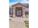 Welcoming front entrance featuring double doors, decorative columns, and manicured landscaping, adding curb appeal at 7524 E Leland Cir, Mesa, AZ 85207