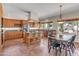 Spacious kitchen with an island, stainless steel appliances, breakfast bar, and adjacent dining area at 7524 E Leland Cir, Mesa, AZ 85207