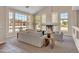 Bright and spacious living room featuring vaulted ceilings, fireplace, large windows and neutral tones at 7524 E Leland Cir, Mesa, AZ 85207