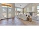 Bright living room featuring soaring ceilings, large windows, tile entry, fireplace, and comfortable seating at 7524 E Leland Cir, Mesa, AZ 85207