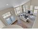 Elevated view of living room featuring a fireplace, many windows and comfortable seating at 7524 E Leland Cir, Mesa, AZ 85207