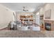 Open floor plan with view to the kitchen, living room with fireplace and entry to outdoor patio at 7524 E Leland Cir, Mesa, AZ 85207