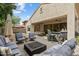 Outdoor patio featuring a full outdoor kitchen, a fire pit and comfortable seating at 7673 E Sands Dr, Scottsdale, AZ 85255