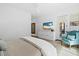 Cozy bedroom boasts ample natural light, stylish chair, and modern entertainment unit at 7673 E Sands Dr, Scottsdale, AZ 85255