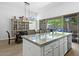 Elegant kitchen featuring a large island with granite countertops, stainless steel appliances, and ample counter space at 7673 E Sands Dr, Scottsdale, AZ 85255