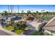 Beautiful waterfront house with a private driveway and lush green landscaping at 8210 E Del Cadena Dr, Scottsdale, AZ 85258