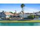 Waterfront home with a fenced backyard, swimming pool and outdoor living area at 8210 E Del Cadena Dr, Scottsdale, AZ 85258