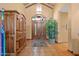 Grand foyer with rustic wood doors and decorative tile floors at 8210 E Del Cadena Dr, Scottsdale, AZ 85258