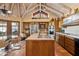 Bright kitchen boasts wooden cabinets, stainless steel appliances, and an island with a butcher block countertop at 8210 E Del Cadena Dr, Scottsdale, AZ 85258