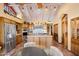Open kitchen featuring wooden cabinets, stainless steel appliances, and a center island with lots of counter space at 8210 E Del Cadena Dr, Scottsdale, AZ 85258