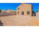 Expansive backyard area offering a blank canvas for landscaping and outdoor enjoyment; home exterior view at 8879 W Cameron Dr, Peoria, AZ 85345