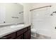Bathroom featuring a vanity, toilet, and shower with white finishes, creating a clean look at 8879 W Cameron Dr, Peoria, AZ 85345
