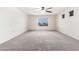 Spacious bedroom with carpet, a window offering a view, and a ceiling fan at 8879 W Cameron Dr, Peoria, AZ 85345