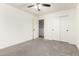 Bedroom featuring carpet, a ceiling fan, and a closet with sliding doors at 8879 W Cameron Dr, Peoria, AZ 85345