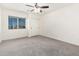 Bedroom with neutral walls, closet, carpet flooring, and a window at 8879 W Cameron Dr, Peoria, AZ 85345