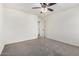 A bedroom with a ceiling fan, neutral walls, and carpet flooring at 8879 W Cameron Dr, Peoria, AZ 85345