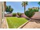 Expansive backyard features artificial turf, mature palms, and a private atmosphere at 8921 W Laurel Ln, Peoria, AZ 85345