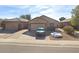 Charming single-story home featuring a low-maintenance front yard, attached garage, and desert landscaping at 8921 W Laurel Ln, Peoria, AZ 85345