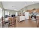 A kitchen area features wood cabinets, stainless steel appliances, and an adjacent seating area at 8921 W Laurel Ln, Peoria, AZ 85345