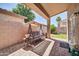 Charming covered patio with brick pavers, ideal for outdoor relaxation and entertaining at 8921 W Laurel Ln, Peoria, AZ 85345