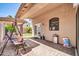Covered patio with pavers, a swing, and easy access to the home and backyard at 8921 W Laurel Ln, Peoria, AZ 85345