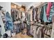 A walk-in closet provides ample storage for clothing and accessories at 8921 W Laurel Ln, Peoria, AZ 85345