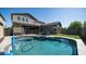 Private backyard with a refreshing pool, and secure fencing at 9936 E Revolution Dr, Mesa, AZ 85212