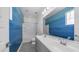 Stylish bathroom featuring double sink vanity, tile floor, and modern fixtures at 9936 E Revolution Dr, Mesa, AZ 85212