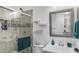 Clean bathroom featuring a glass-enclosed shower and modern vanity at 9936 E Revolution Dr, Mesa, AZ 85212