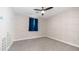 Comfortable bedroom featuring brick accent wall, neutral carpet, and ample light at 9936 E Revolution Dr, Mesa, AZ 85212