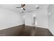 Spacious bedroom features hardwood floors, recessed lighting and ceiling fan at 9936 E Revolution Dr, Mesa, AZ 85212