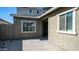 Exterior view showing a private entry and neutral stucco with clean lines at 9936 E Revolution Dr, Mesa, AZ 85212