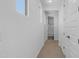 Hallway view showcasing interior doors and a glimpse into the bathroom at 9936 E Revolution Dr, Mesa, AZ 85212