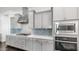 Well-equipped kitchen boasts modern appliances, sleek countertops, and stylish backsplash at 9936 E Revolution Dr, Mesa, AZ 85212